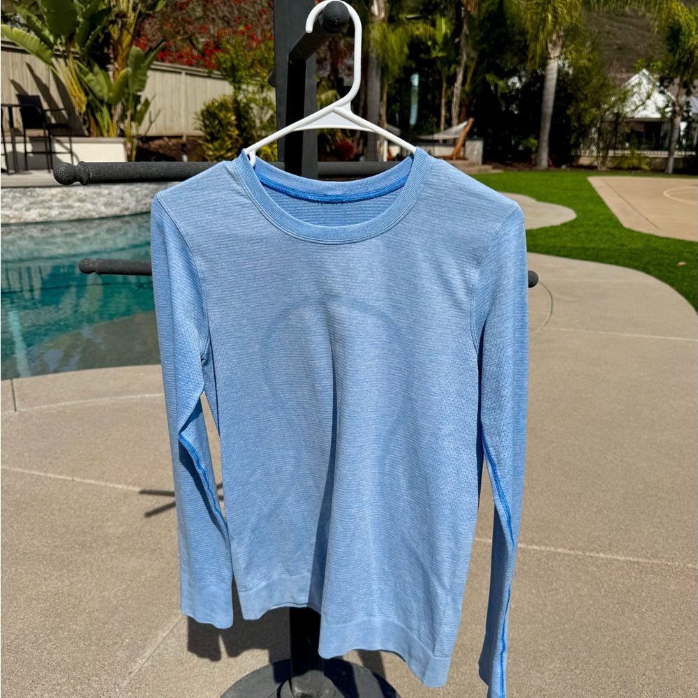LuLuLemon Swiftly relaxed fit light blue long sleeve hip length shirt